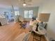 Inviting living room with stylish decor, ceiling fan, and lots of natural light at 107 Pawleys Place Dr. # 107, Pawleys Island, SC 29585