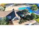 Aerial view of a community pool with lush landscaping and a white pergola at 107 Pawleys Place Dr. # 107, Pawleys Island, SC 29585