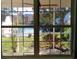 Charming view of the pond and fountain through a bright window at 107 Pawleys Place Dr. # 107, Pawleys Island, SC 29585
