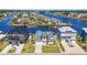 Aerial view showcases the waterfront property with boat access and lush landscaping at 109 Serenity Point Dr., Little River, SC 29566