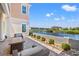 Patio and outdoor space with canal views featuring lush landscaping and boat dock at 109 Serenity Point Dr., Little River, SC 29566