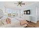 Comfortable bedroom with view of the outside, ceiling fan, wood floors, and white dresser at 109 Serenity Point Dr., Little River, SC 29566