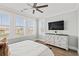 Bright bedroom with large windows offering scenic waterfront views at 109 Serenity Point Dr., Little River, SC 29566