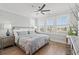 Stylish bedroom with large windows providing lots of natural light and views at 109 Serenity Point Dr., Little River, SC 29566
