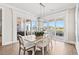 Elegant dining area features natural light, views of the water, and a modern light fixture at 109 Serenity Point Dr., Little River, SC 29566