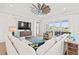 Comfortable living room showcases generous seating, TV, outside access, and seamlessly adjoins the kitchen at 109 Serenity Point Dr., Little River, SC 29566