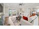 Bright living room with modern decor and sliding glass doors to a scenic balcony at 109 Serenity Point Dr., Little River, SC 29566