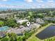 Wide aerial view showing condominium complex with tennis courts, beach and pond views at 1100 Possum Trot Rd. # C-203, North Myrtle Beach, SC 29582
