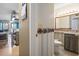 Well-lit half bath with seashell wallpaper border, updated vanity, and ceramic tile flooring at 1100 Possum Trot Rd. # C-203, North Myrtle Beach, SC 29582