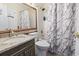 Bathroom featuring a marble countertop vanity, framed mirror, and tub with shower at 1100 Possum Trot Rd. # C-203, North Myrtle Beach, SC 29582