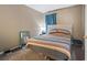 Comfortable bedroom with a colorful bedspread and calming decor at 1100 Possum Trot Rd. # C-203, North Myrtle Beach, SC 29582