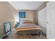 Comfortable bedroom with a stylish bed, ample closet space, and neutral color scheme at 1100 Possum Trot Rd. # C-203, North Myrtle Beach, SC 29582