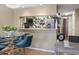 Charming dining area adjacent to kitchen with a unique backsplash design and stainless steel appliances at 1100 Possum Trot Rd. # C-203, North Myrtle Beach, SC 29582