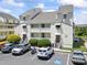 Charming condo building with balconies, parking, and accessible parking in a convenient location at 1100 Possum Trot Rd. # C-203, North Myrtle Beach, SC 29582