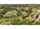 Picturesque aerial shot of a golf course winding through lush greenery and mature trees at 1100 Possum Trot Rd. # C-203, North Myrtle Beach, SC 29582