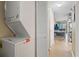 Hallway featuring stackable washer and dryer near the living areas at 1100 Possum Trot Rd. # C-203, North Myrtle Beach, SC 29582