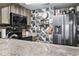 Spacious kitchen with modern appliances and a stylish backsplash behind the range and refrigerator at 1100 Possum Trot Rd. # C-203, North Myrtle Beach, SC 29582