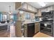 Well-equipped kitchen featuring modern appliances, stylish countertops and a pass-through to the living area at 1100 Possum Trot Rd. # C-203, North Myrtle Beach, SC 29582