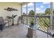 Screened-in porch with ceramic tile floor and view of trees and nearby buildings at 1100 Possum Trot Rd. # C-203, North Myrtle Beach, SC 29582