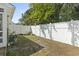 A fenced backyard with green grass and some planted flowers at 1102 Stanton Pl. # 1102, Myrtle Beach, SC 29579