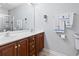 Bathroom featuring a double sink vanity with dark wood cabinets and brushed nickel fixtures at 1102 Stanton Pl. # 1102, Myrtle Beach, SC 29579