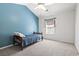 Bedroom with light carpet, bright blue accent wall, and a single bed at 1102 Stanton Pl. # 1102, Myrtle Beach, SC 29579