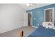 Bedroom featuring carpet and blue accent wall with a single bed at 1102 Stanton Pl. # 1102, Myrtle Beach, SC 29579
