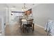Dining room with open concept kitchen, breakfast bar, wood floors, and natural light at 1102 Stanton Pl. # 1102, Myrtle Beach, SC 29579