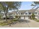 Exterior view of townhomes featuring garages, landscaping, and driveways at 1102 Stanton Pl. # 1102, Myrtle Beach, SC 29579