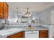 Kitchen with granite counters and stainless faucet looks into the dining and living areas at 1102 Stanton Pl. # 1102, Myrtle Beach, SC 29579