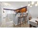 Open concept kitchen with a breakfast bar, granite countertops, and wood cabinets at 1102 Stanton Pl. # 1102, Myrtle Beach, SC 29579
