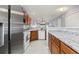 Open kitchen featuring granite countertops, wooden cabinets, and stainless steel appliances at 1102 Stanton Pl. # 1102, Myrtle Beach, SC 29579