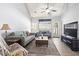 Cozy living room with vaulted ceiling, ceiling fan, hardwood floors, and lots of natural light at 1102 Stanton Pl. # 1102, Myrtle Beach, SC 29579