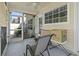 Enclosed back porch with a ceiling fan and view of the backyard at 1102 Stanton Pl. # 1102, Myrtle Beach, SC 29579