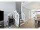 Open staircase with white railings, wood floors, and a convenient stair lift at 1102 Stanton Pl. # 1102, Myrtle Beach, SC 29579
