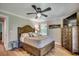 Bedroom featuring hardwood floors, a large bed, and ample natural light from a window at 112 Blue Gull Dr., Conway, SC 29526