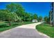 Spacious front yard of fenced home features a long driveway leading to the detached garage and home at 112 Blue Gull Dr., Conway, SC 29526