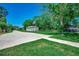 Spacious driveway with a basketball hoop leading to the detached garage, offering ample space for vehicles at 112 Blue Gull Dr., Conway, SC 29526