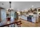 Spacious eat-in kitchen features wood-look flooring, stainless appliances, and lots of cabinet storage at 112 Blue Gull Dr., Conway, SC 29526
