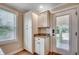Eat-in kitchen with pantry storage, granite countertops, and an exterior door at 112 Blue Gull Dr., Conway, SC 29526