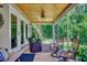 Covered outdoor seating area featuring comfortable chairs, wood flooring, and scenic views at 112 Blue Gull Dr., Conway, SC 29526