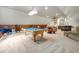 Spacious basement with a pool table and multiple seating areas for entertaining guests at 113 Trotter Trail, Georgetown, SC 29440