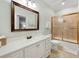 Bathroom featuring a vanity with a large mirror, a toilet, and a shower with glass doors at 113 Trotter Trail, Georgetown, SC 29440
