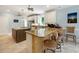 Modern kitchen with granite countertops, island with seating, and stainless steel appliances, ideal for cooking and gathering at 113 Trotter Trail, Georgetown, SC 29440