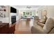 Bright living room with fireplace, built-in bookshelves and comfortable sofas, creating an inviting and stylish atmosphere at 113 Trotter Trail, Georgetown, SC 29440