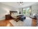 Comfortable main bedroom with a large bed, stylish decor, and natural light from the window at 113 Trotter Trail, Georgetown, SC 29440