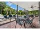 Stylish outdoor living on screened patio overlooking the pool and landscaped yard at 113 Trotter Trail, Georgetown, SC 29440