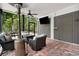 Comfortable screened patio with a tall heater and views of lush greenery at 113 Trotter Trail, Georgetown, SC 29440
