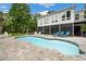 Backyard pool with a spa, screened porch and a meticulously landscaped patio area at 113 Trotter Trail, Georgetown, SC 29440