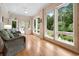 Bright sunroom featuring walls of windows with outdoor access, offering serene views and natural light at 113 Trotter Trail, Georgetown, SC 29440